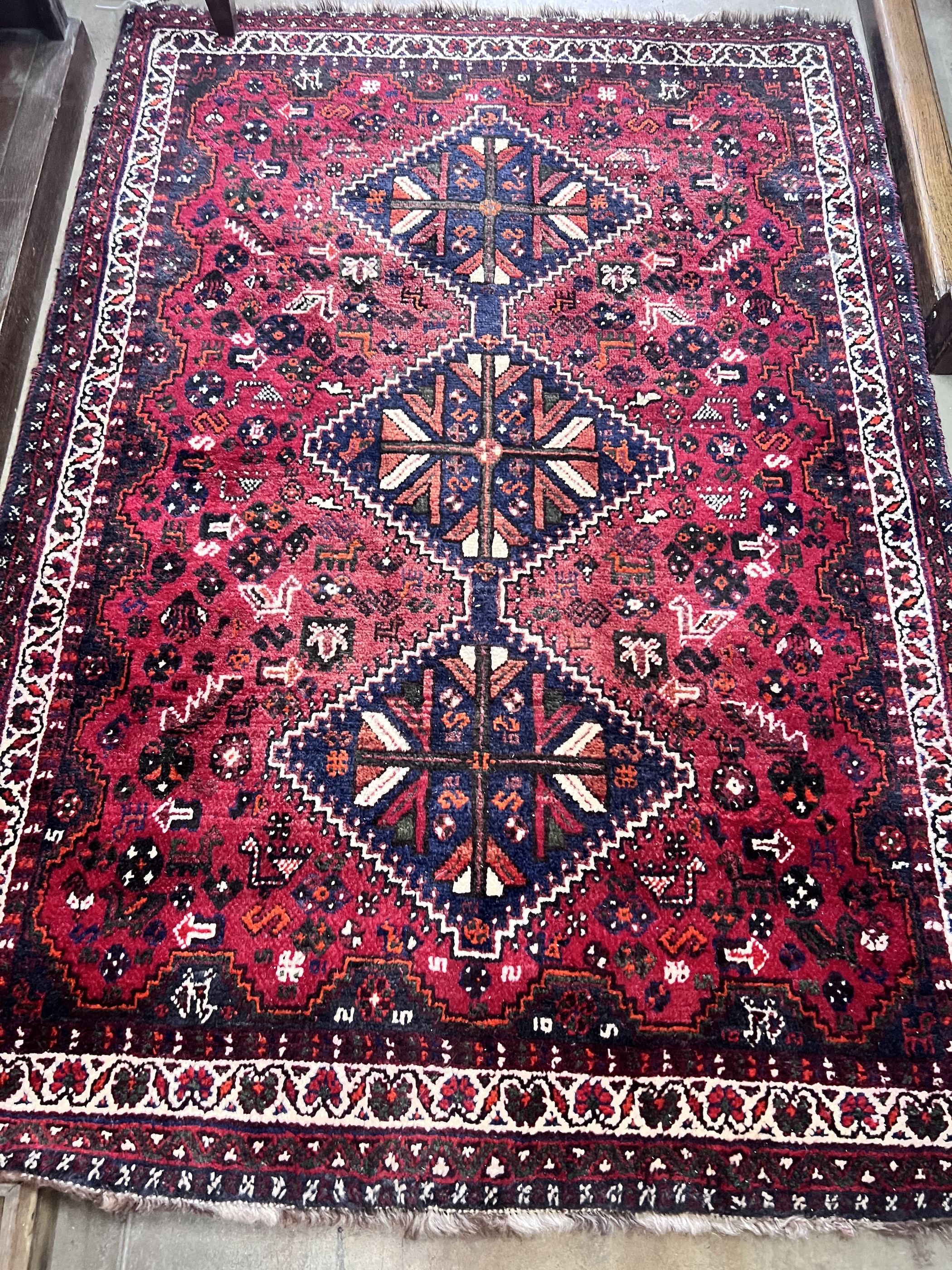 A Belouch red ground rug, 172 x 122cm